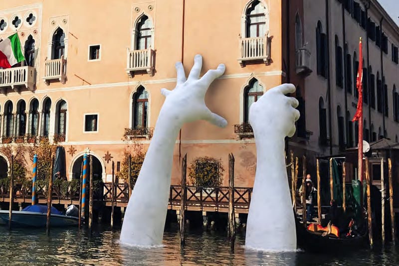 Massive Hands Emerge From Canals for Venice Biennale