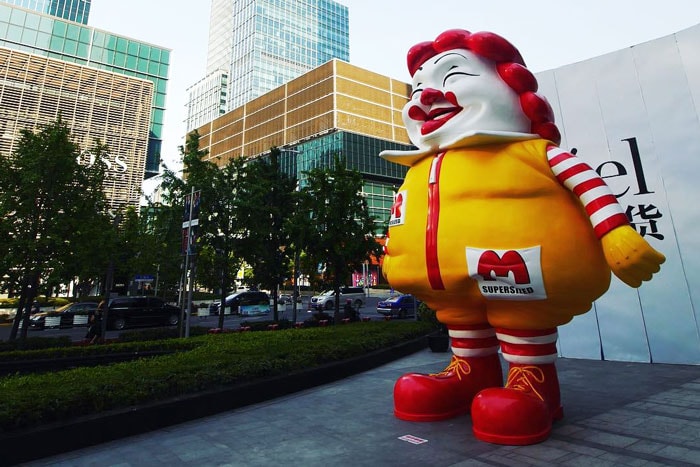 Ron English's Colossal Ronald McDonald & Statue of Liberty Works Taken Down in Shanghai