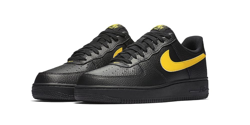 black air force with yellow swoosh