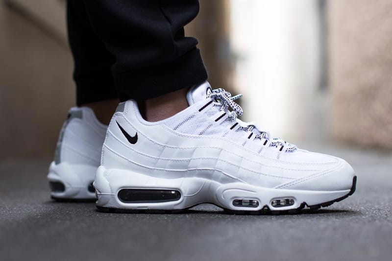 all white air max 95 with black nike sign