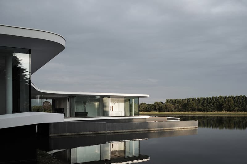 AUM Architects Architecture Design White Snake House France Lake Top White Concrete Glass Swimming Pool Gym