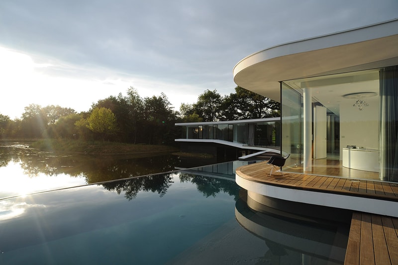 AUM Architects Architecture Design White Snake House France Lake Top White Concrete Glass Swimming Pool Gym