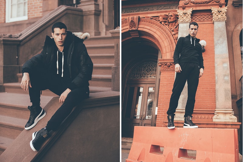 Puma Clyde Mid Foil Leather black model sitting on stoop