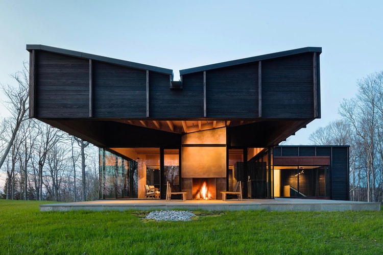 The Michigan Lake House Is a Modernist's Take on the Humble Log Cabin