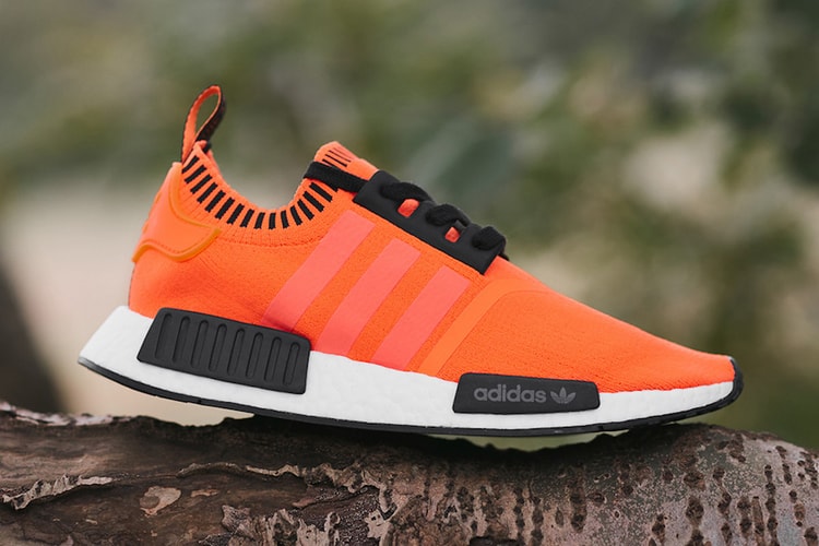 size? Dresses the adidas NMD R1 in Neon Orange