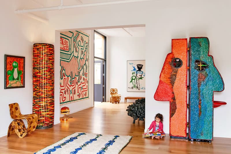 KAWS Brooklyn Home House Architectural Digest Cover Story takashi murakami paintings studio magazine wall sculptures bff chairs
