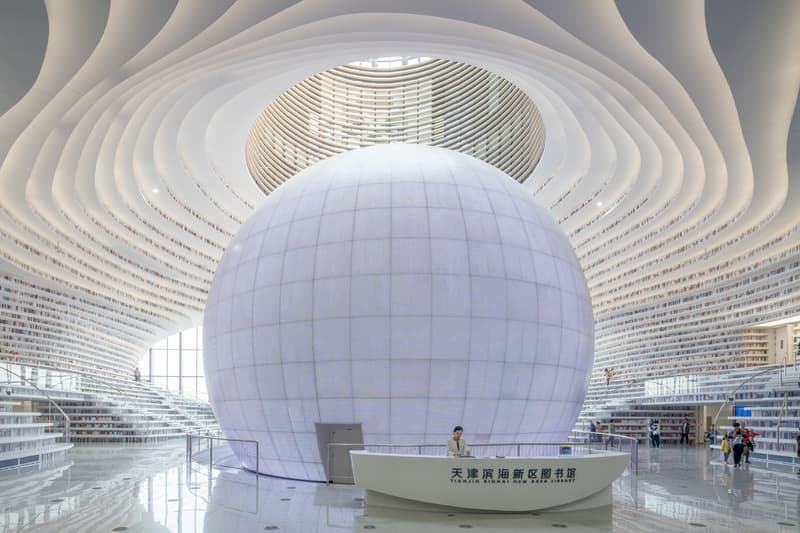 Tianjin Binhai Library China Design By MVRDV develop GMP architekten architecture architectures sphere ball white bgass urban planning and design institute TUPDI cave books bookshelves bookshelf orb eye