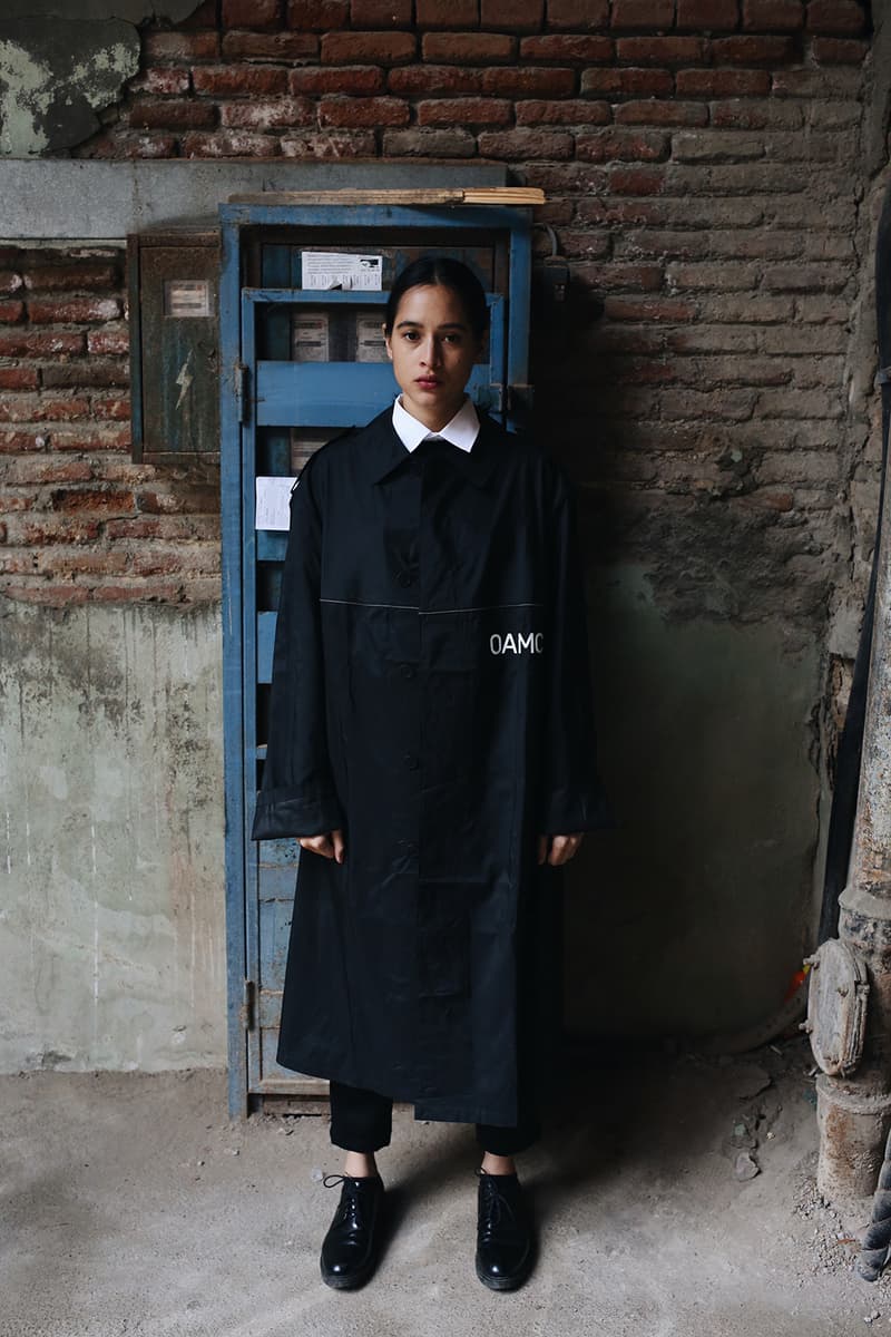 OAMC "Peacemaker" black nylon trench coat Military-inspired Luke Meier