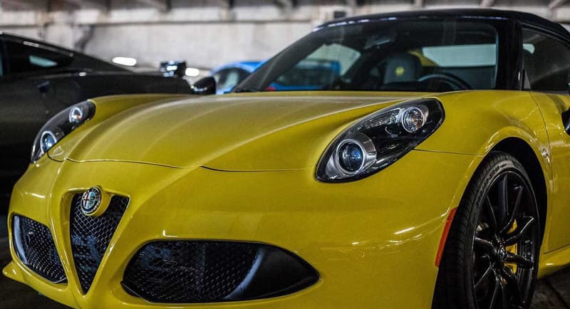 Supercars Collecting Dust Parking Garage Alfa Romeo Aston Martin Chevrolet Chrysler Prowler Ferrari Ford GT Mustang Jaguar Lamborghini Aventador Porsche