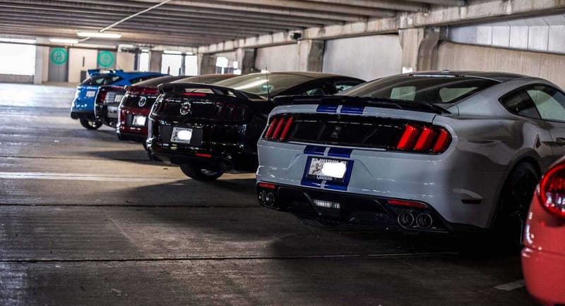 Supercars Collecting Dust Parking Garage Alfa Romeo Aston Martin Chevrolet Chrysler Prowler Ferrari Ford GT Mustang Jaguar Lamborghini Aventador Porsche