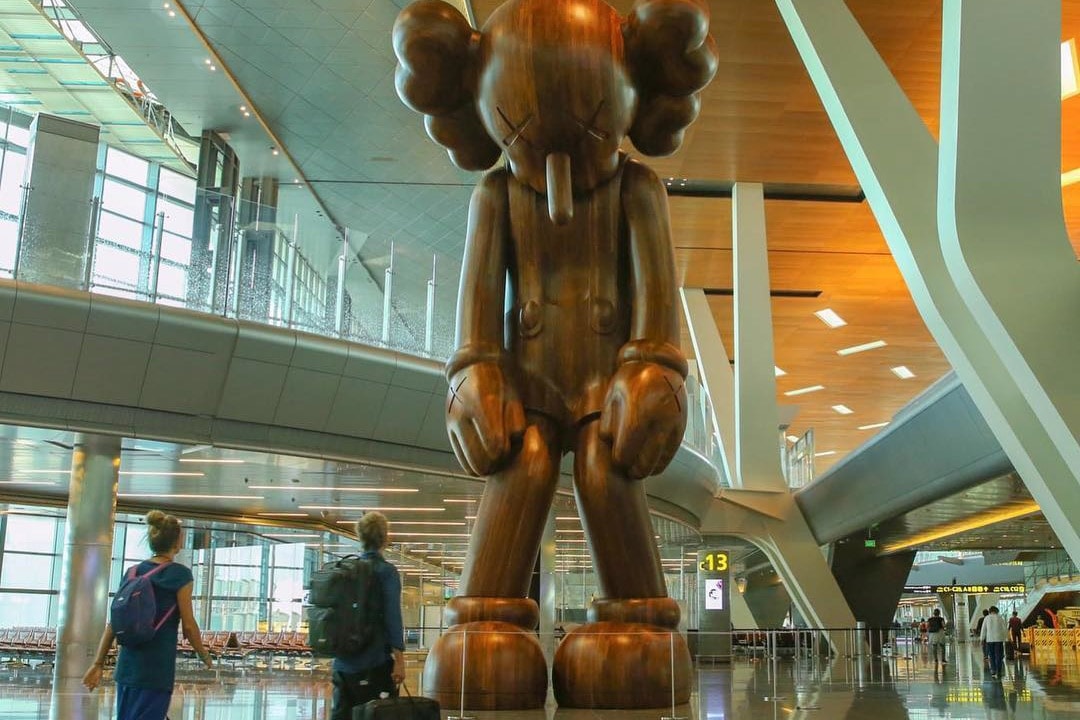 kaws small lie companion sculpture hamad international airport qatar museums art artwork statue