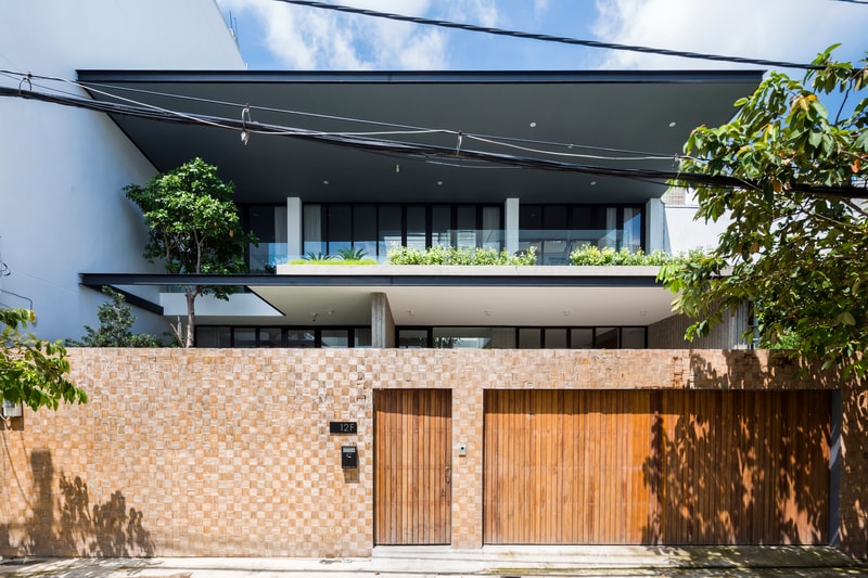 Patio House MM++ Architects Ho Chi Minh City Vietnam Open Plan Modern Interior Exterior Plants Wooden Balcony