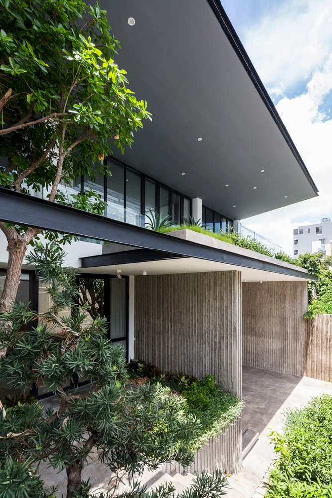 Patio House MM++ Architects Ho Chi Minh City Vietnam Open Plan Modern Interior Exterior Plants Wooden Balcony