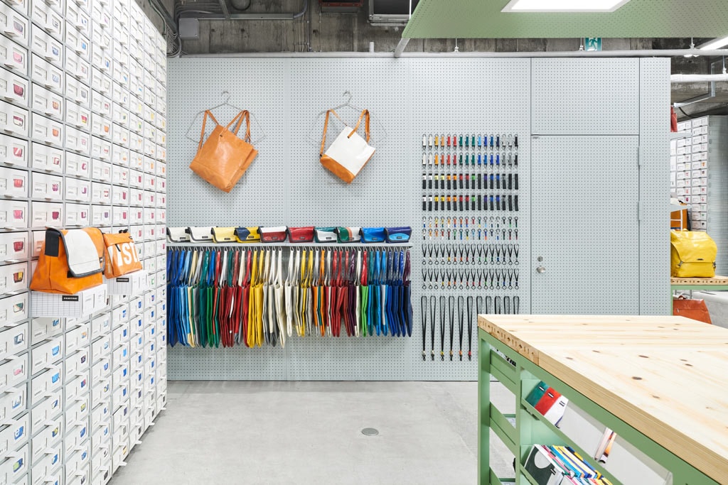 TORAFU ARCHITECTS FREITAG Osaka Store Kiosk Outfitter Shop Store Colorful Messenger Bags Accessories Wooden Steel Furniture Industrial Atmosphere