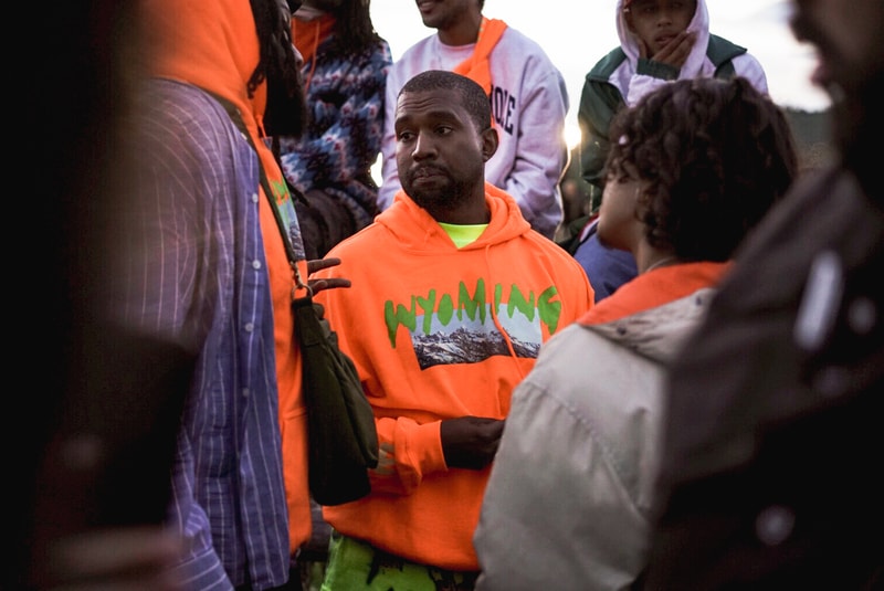 kanye-west-wyoming-album-listening-party-merch-orange-hoodie-yellow-tee-shirt