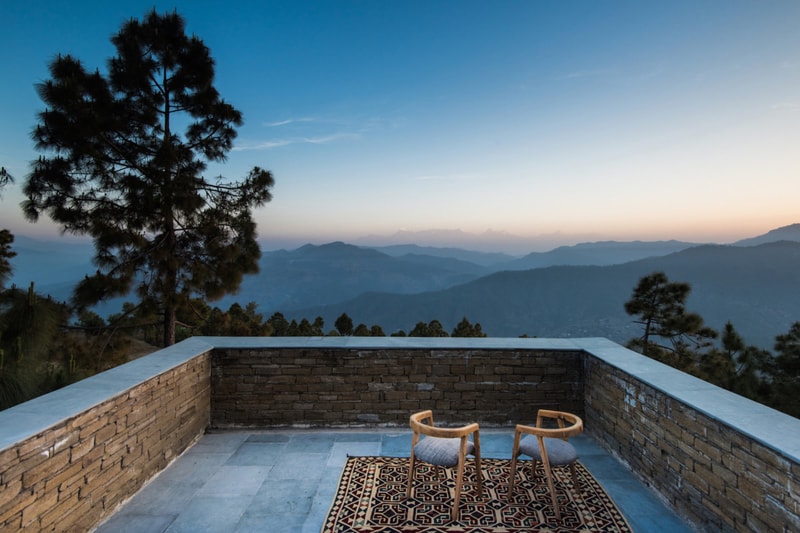 Kumaon Hotel India Brick Building Gardens Balconies Mountainous Landscape Trees Sleek Modern Interior Exterior Zowa Architects Design Studio