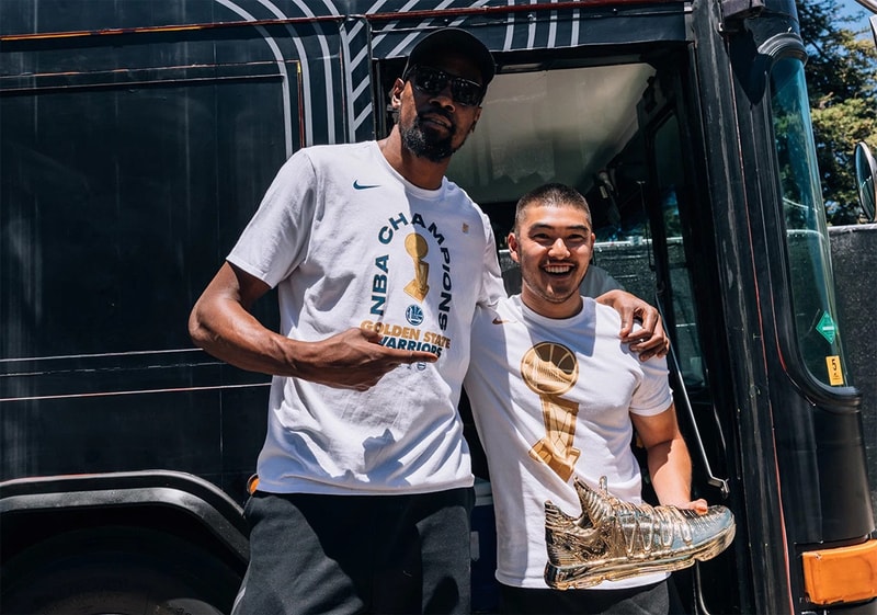 Kevin Durant Nike KD 10 “Art Of A Champion” Gold dipped NBA Golden State Warriors special suitcase alongside merchandise KD artwork 16 slash mark hangtag