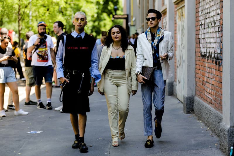 milan fashion week street style spring summer 2019 syntax error black vest louis vuitton clutch bag hermes belt gucci slippers blue shirt sweater vest shorts black