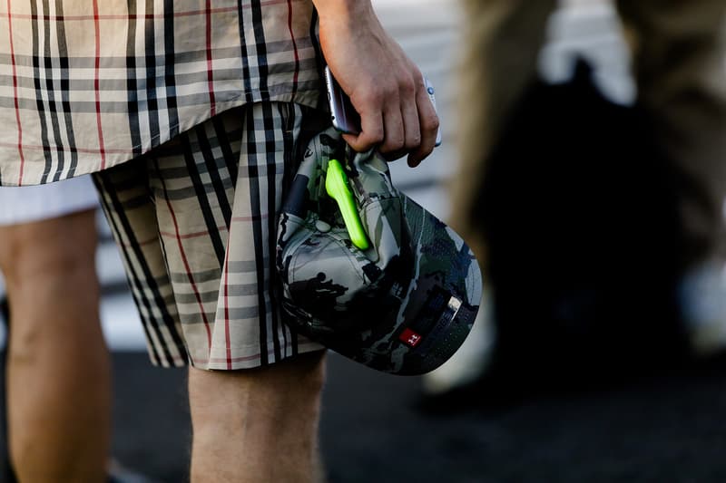 milan fashion week street style spring summer 2019 burberry plaid check shirt shorts camouflage under armour hat cap