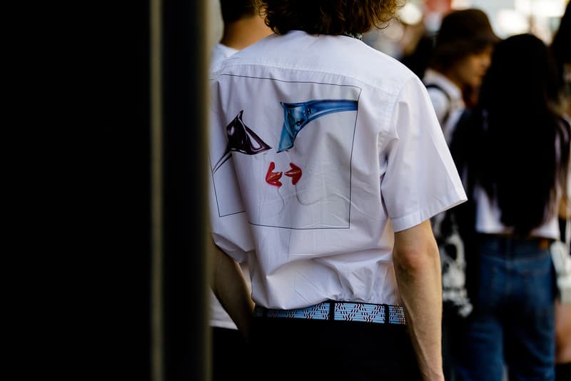 milan fashion week street style spring summer 2019 white graphic tee shirt braided belt short sleeve black pants