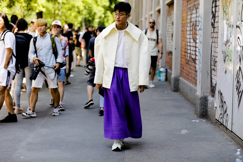 milan fashion week street style spring summer 2019 blue wide skirt pants beige jacket oversized white tee shirt thin glasses earrings nike vapor fly 4