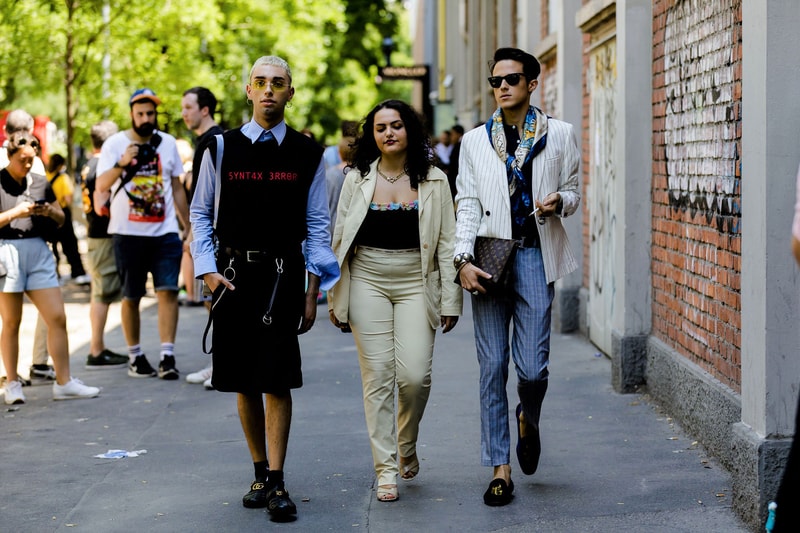 milan fashion week street style spring summer 2019 syntax error black vest louis vuitton clutch bag hermes belt gucci slippers blue shirt sweater vest shorts black