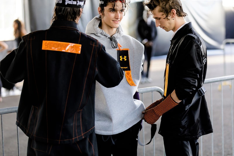 palm angels spring summer 2019 milan fashion week grey sweater hoodie under armour logo black jacket orange tag yellow arm warmers harness
