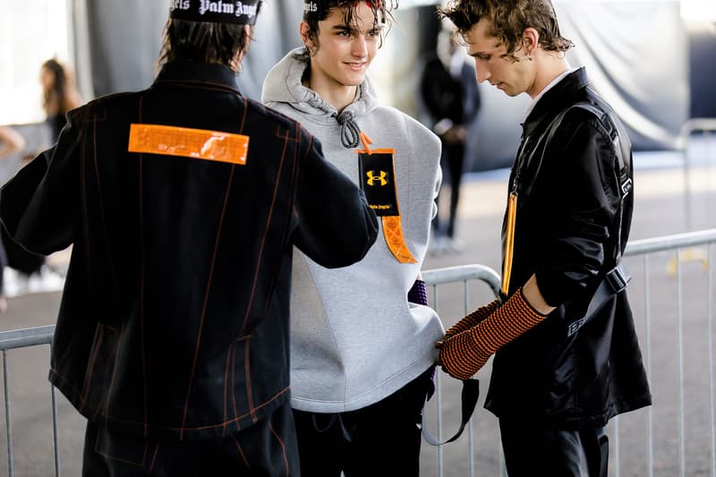 palm angels spring summer 2019 milan fashion week grey sweater hoodie under armour logo black jacket orange tag yellow arm warmers harness