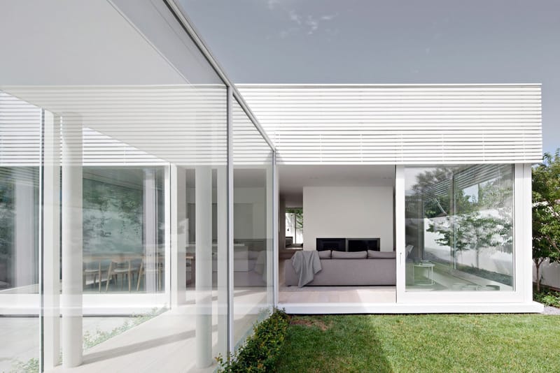 The All-White House Both Stands out and Blends in With Its Surroundings