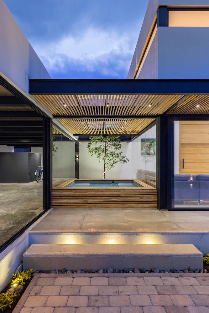 the collectors house ecuador interior design architecture home living space hot tub vintage car pool CU+AR ESTUDIO