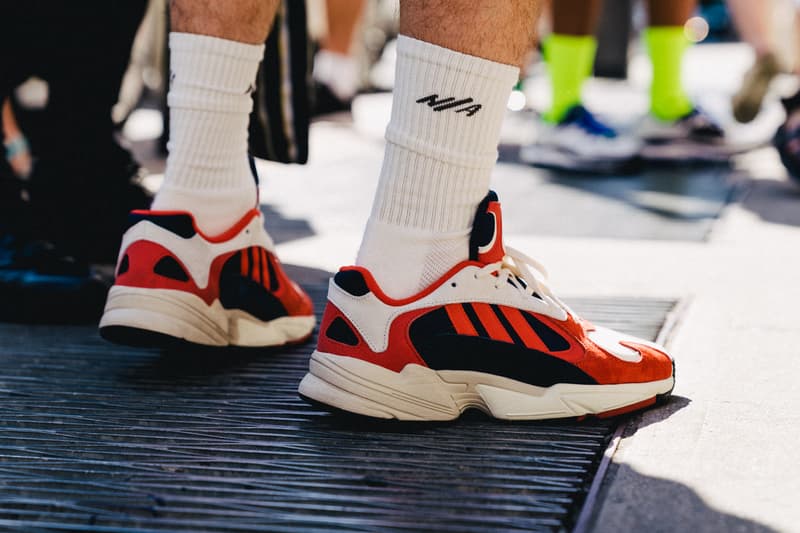 new york fashion week spring summer 2019 city street style snap photograph balenciaga nike off white ufc blue white air jordan 1 prada shirt leather vest floral tropical pattern football soccer jersey comme des garcons pink sneaker bapesta desert rat black