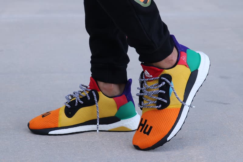 Pharrell adidas Solar Hu Glide ST Early Look rainbow colorway boost midsole yellow orange blue pink black white green pattern laces collaboration drop on foot side black