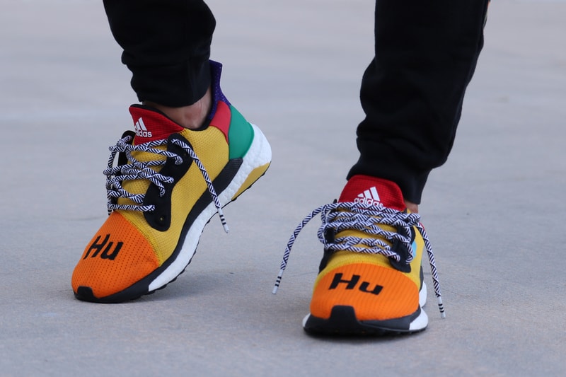 Pharrell adidas Solar Hu Glide ST Early Look rainbow colorway boost midsole yellow orange blue pink black white green pattern laces collaboration drop on foot side black