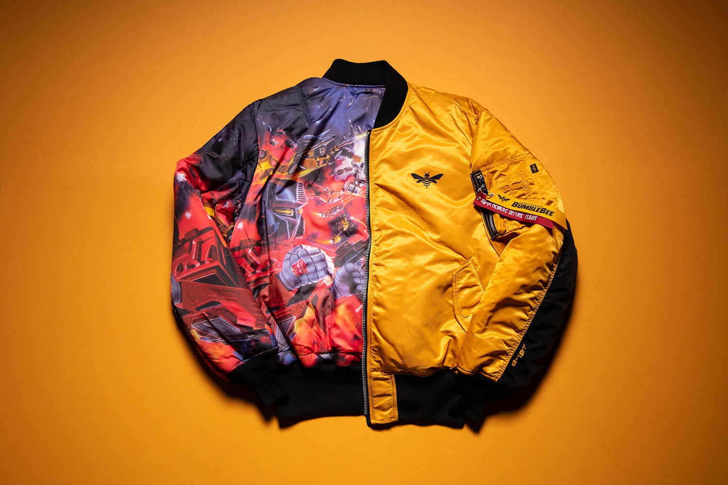 Hasbro Alpha Industries MA-1 Flight Jacket Bumblebee Transformers reversible yellow movie michael bay limited edition win raffle sign up early access buy purchase sale film tie in merch