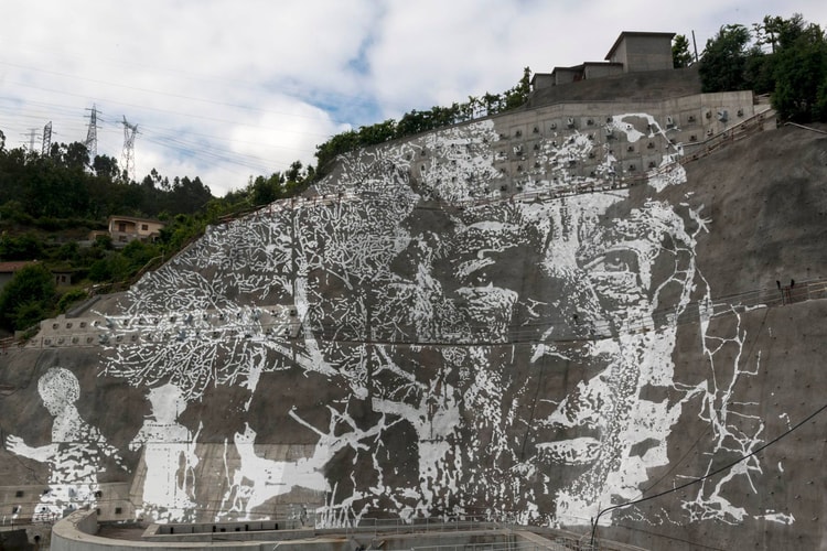 VHILS Chisels Giant Portrait onto Portuguese Dam