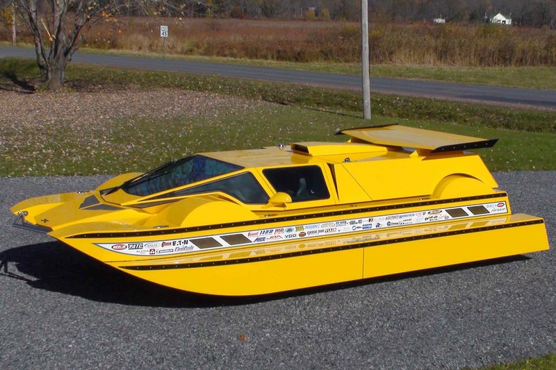 hydrocar surface orbiter transformable amphibious car vehicle water road street 1 one million usd auction sale yellow boat Rick Dobbertin Worldwide Auctioneers
