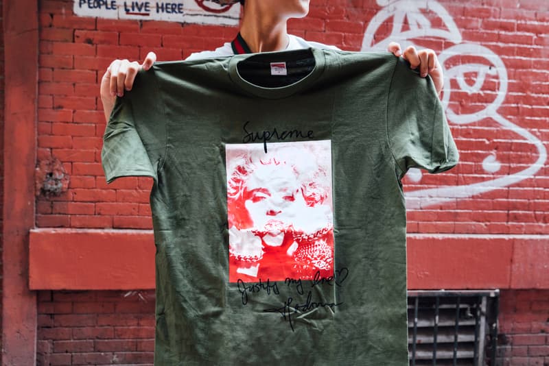supreme fall winter 2018 drop day first august 16 madonna tee shirt melton wool leather sleeve varsity jacket stickers bouncey ball keychain black graphic tee shirt street style snap audience crowd fans line queue new york city brooklyn
