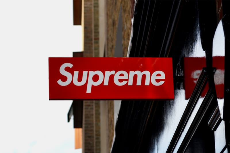 supreme london store storefront shop sign defaced vandalized vandal damaged reward box logo crewneck bogo man person