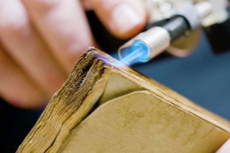 See How a Paper Propmaker Crafts Fake Documents for Films