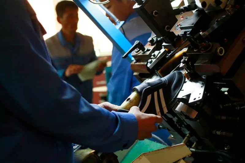 North Korean Shoe Factories Replicate Foreign Brands' Sneakers nike jordan brand adidas asics info images footwear 