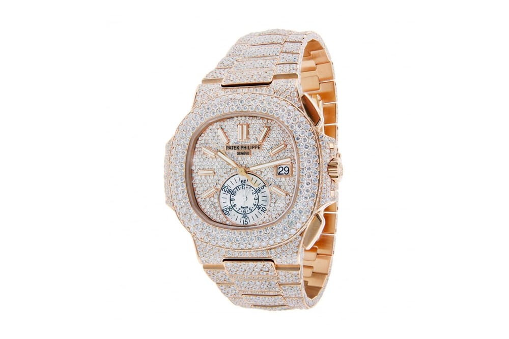 Patek Philippe Diamond-Encrusted Nautilus Watch pink gold rose gold timepiece $129,019 price release info 18 karat gold 40mm diamond bezel dial index markers 5980/1R-001