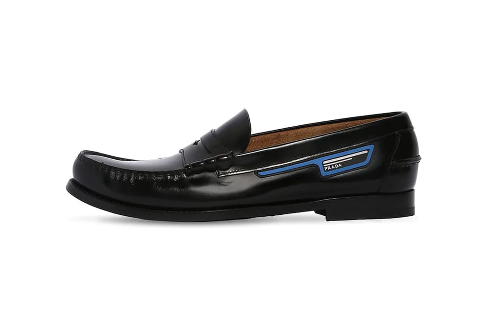 Prada Unveils its Unorthodox Take on Leather Penny Loafers black info images drop release date footwear luisaviaroma