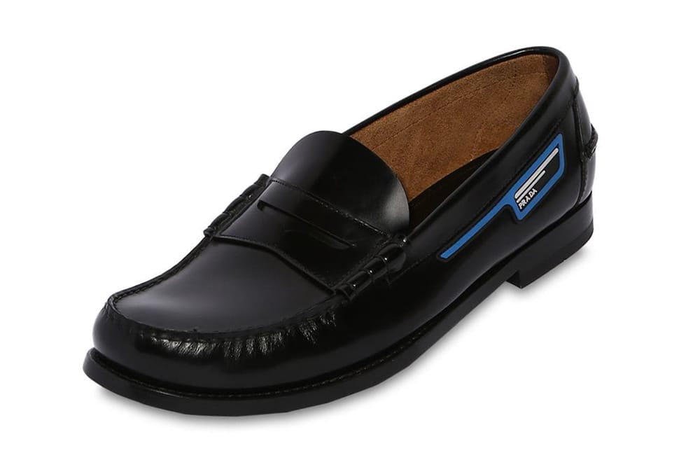 Prada Unveils its Unorthodox Take on Leather Penny Loafers black info images drop release date footwear luisaviaroma