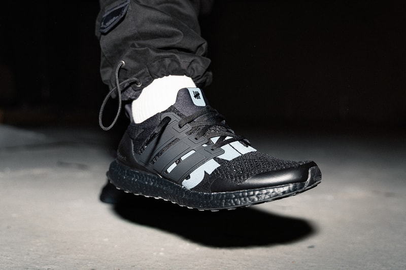 UNDEFEATED x adidas Ultra Boost 1.0 Triple Black Reflective Closer First Look Cop Purchase Buy Sneakers Kicks Trainers Footwear Collab Collaborations