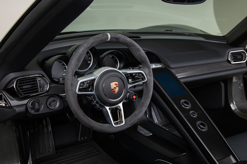 Porsche 918 Spyder Hybrid Onyx Black Silver Accents Environmental Super Car Hypercar Weissach Package 628 miles magnesium motorsport wheels, lighter brake design titanium bolts chassis rear carbon fibre spoilers 214 mph 875bhp 2.4seconds 944 lb-ft torque 4.6ltr V8 Race Engine 