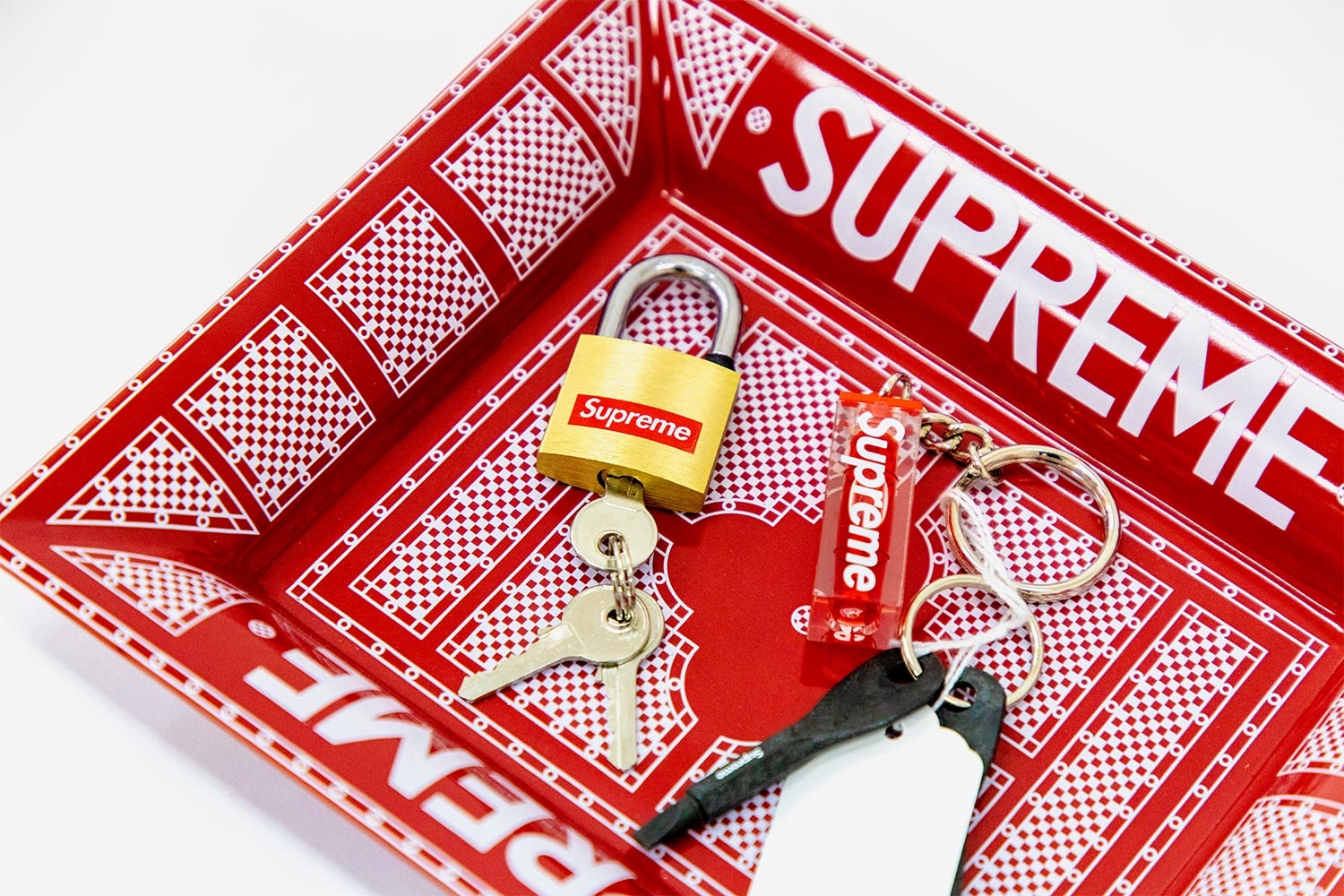 Sotheby's Supreme Accessories Auction News box logo skate new york louis vuitton punching bag edc scarface bogo stickers brick red anti hero B&O 