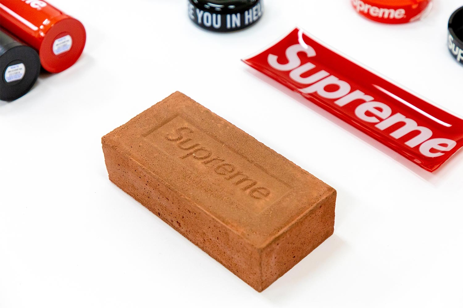 Sotheby's Supreme Accessories Auction News box logo skate new york louis vuitton punching bag edc scarface bogo stickers brick red anti hero B&O 
