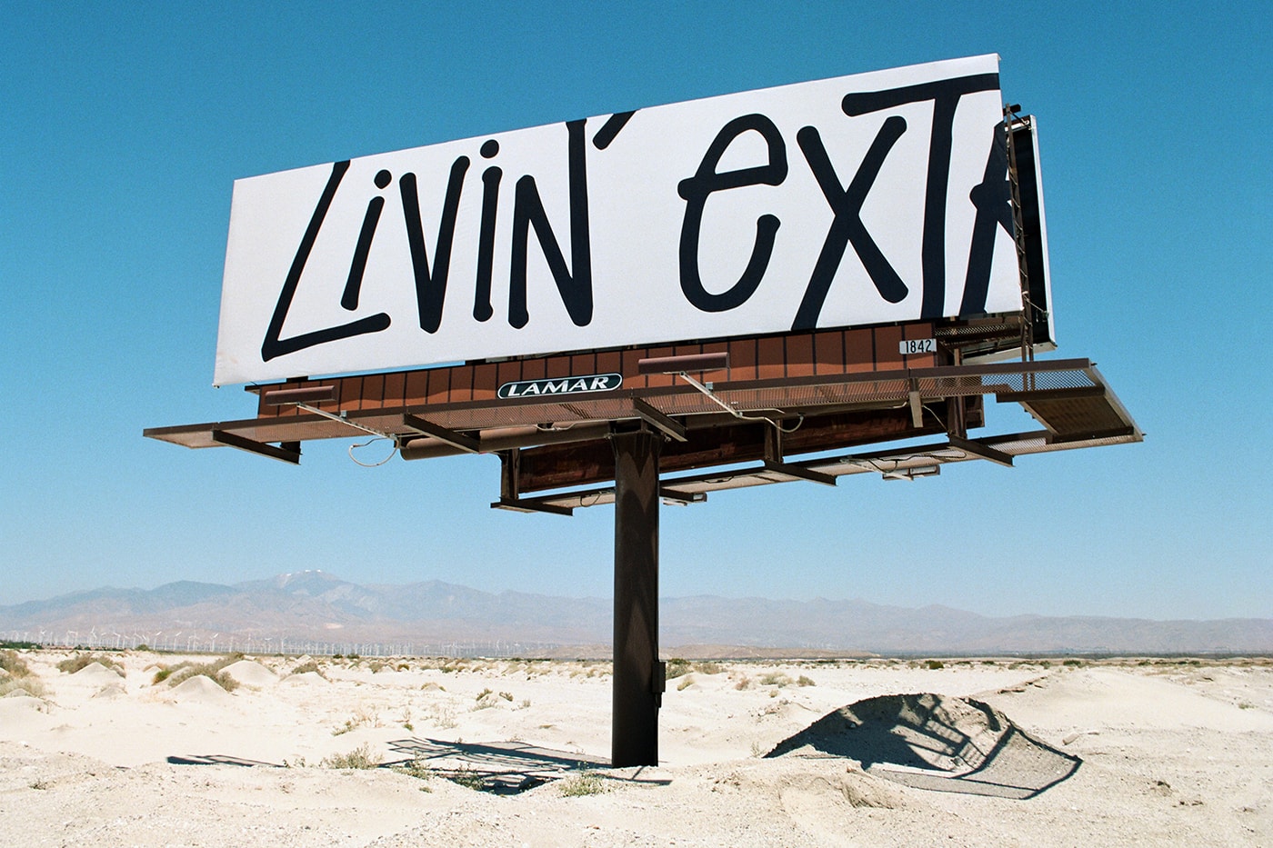 Stussy LIVIN EXTRA LARGE T shirt billboards california desert white black tee motto broadcast blue skies highway campaign project initiative