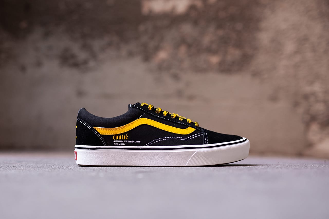 black and white checkered vans with yellow stripe