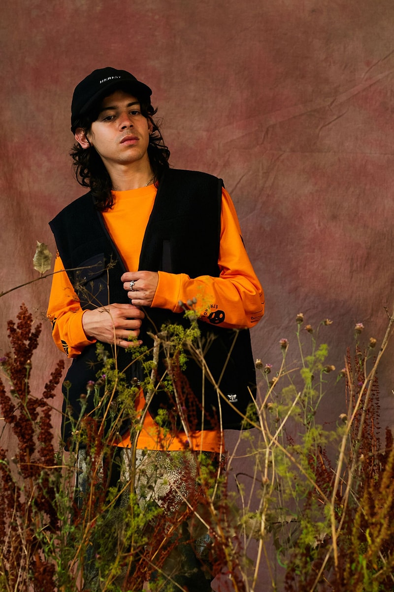 HERESY Fall Winter 2019 FW19 Collection Lookbook Arktis Collaboration "Growing" Folk Nomadic Prints Designs Blanket Scarf Outerwear Coats Camouflage Print Workwear Gloves Hats 